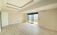 Duplex apartment on the 10th floor with an attic in Alanya's popular Mahmutlar area.-id-3882-photo-3