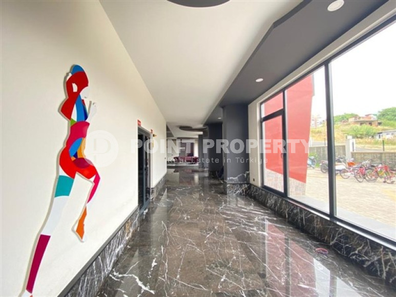 Duplex apartment on the 10th floor with an attic in Alanya's popular Mahmutlar area.-id-3882-photo-9