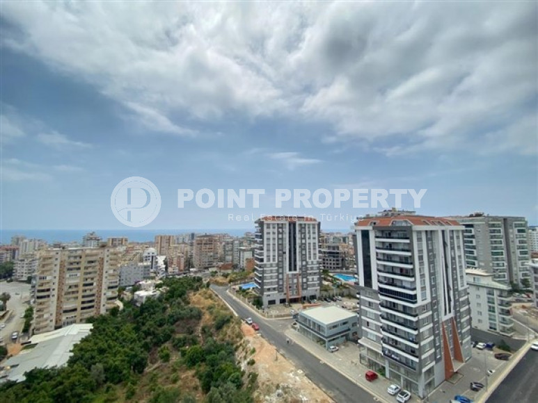 Duplex apartment on the 10th floor with an attic in Alanya's popular Mahmutlar area.-id-3882-photo-11