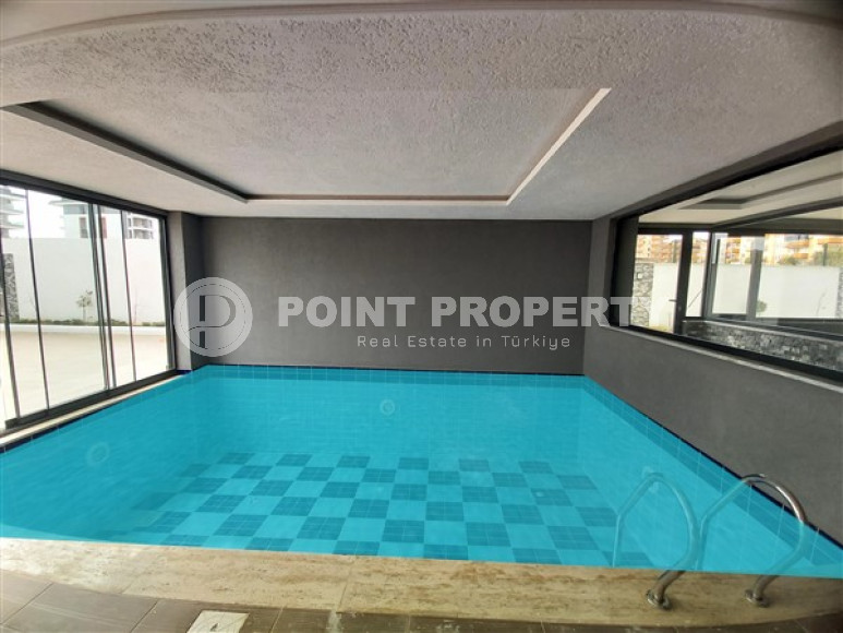 Inexpensive two-room apartment 50 m2 in a newly built complex 500 meters from the sea, Kargicak-id-3895-photo-14