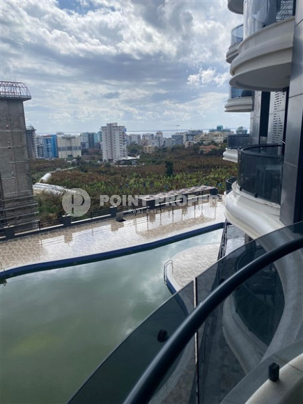 Двухкомнатные апартаменты 1+1 в новой резиденции с отличной инфраструктурой и бассейном на крыше, район Махмутлар-id-3896-фото-8