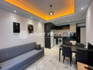 Stylish 1+1 apartment on the 9th floor in a building built in 2022 in the center of Mahmutlar.-id-3906-photo-1