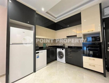 Stylish 1+1 apartment on the 9th floor in a building built in 2022 in the center of Mahmutlar.-id-3906-photo-3