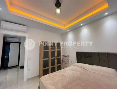 Stylish 1+1 apartment on the 9th floor in a building built in 2022 in the center of Mahmutlar.-id-3906-photo-4