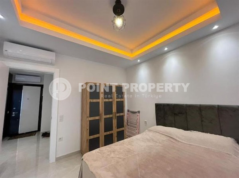 Stylish 1+1 apartment on the 9th floor in a building built in 2022 in the center of Mahmutlar.-id-3906-photo-4