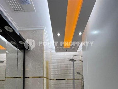 Stylish 1+1 apartment on the 9th floor in a building built in 2022 in the center of Mahmutlar.-id-3906-photo-5