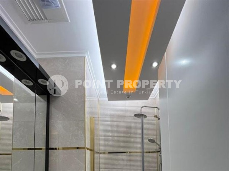 Stylish 1+1 apartment on the 9th floor in a building built in 2022 in the center of Mahmutlar.-id-3906-photo-5