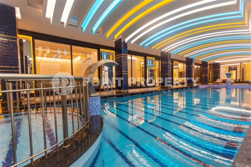 Stylish 1+1 apartment on the 9th floor in a building built in 2022 in the center of Mahmutlar.-id-3906-photo-9