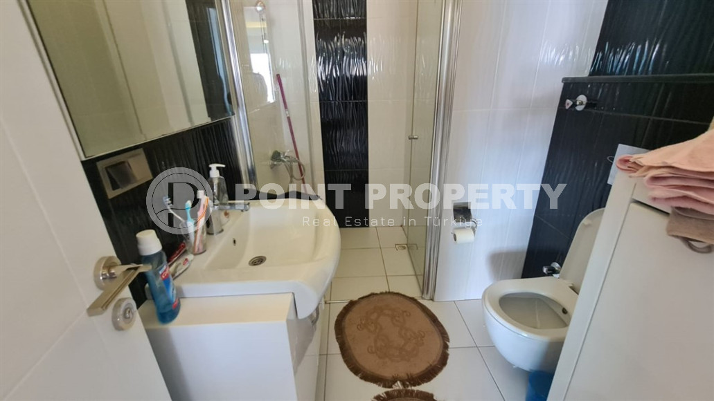 Cozy two-room apartment with a 1+1 layout and an area of 75 m2 in a complex with a swimming pool in the Mahmutlar area, 400 meters from the sea-id-1329-photo-12