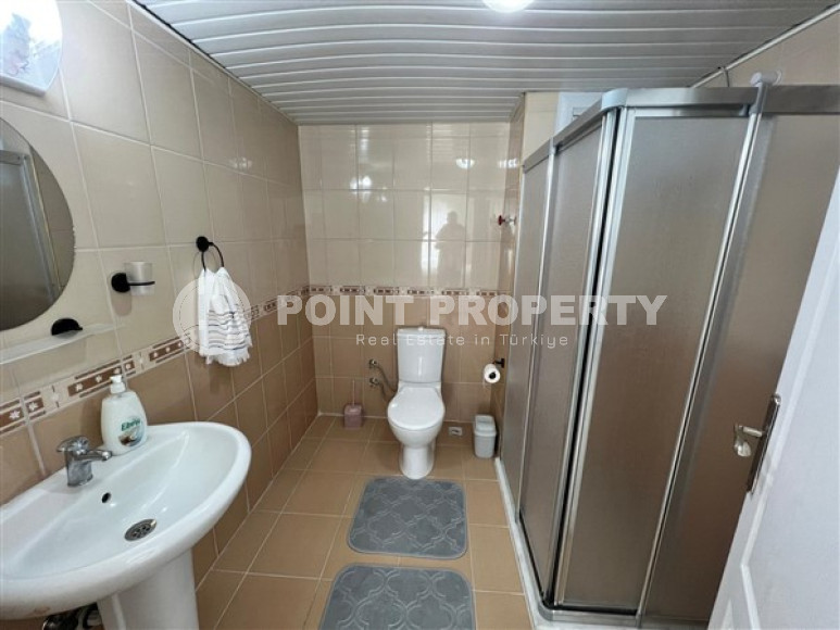 Стильная двухкомнатная квартира в центре благоустроенного престижного района Аланьи Тосмур.-id-3924-фото-7