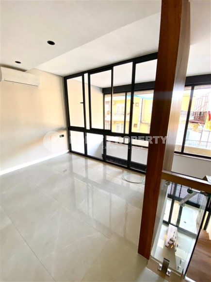 Стильный современный дуплекс с одной спальней, общей площадью 60 м2, в 150 метрах от знаменитого пляжа Клеопатры.-id-3944-фото-3