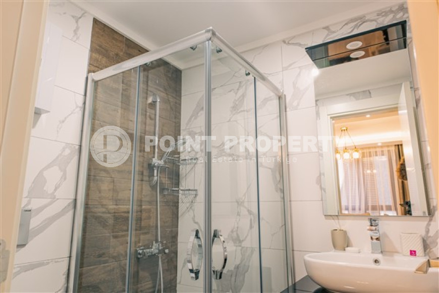 Стильная современная квартира 1+1 в новом доме в самом центре Аланьи.-id-3948-фото-7