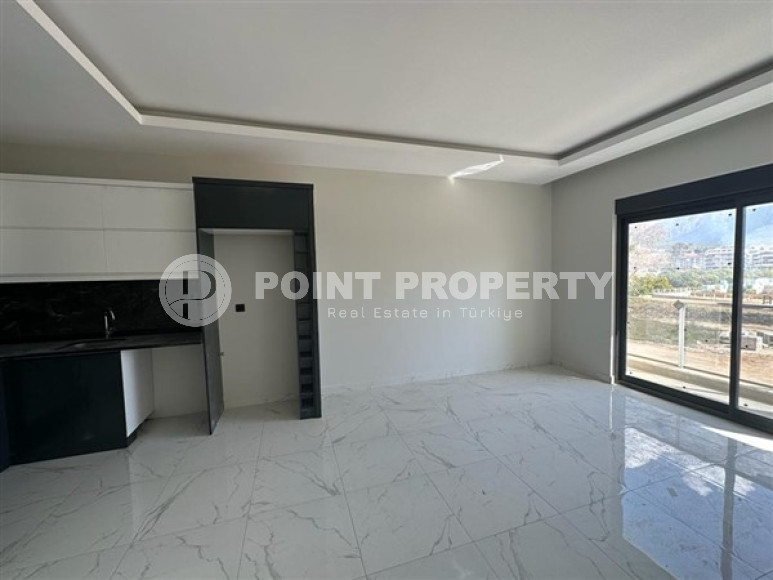 Двухкомнатные апартаменты с планировкой 1+1 в резиденции 2022 года на некотором удалении от моря, район Оба-id-3955-фото-6