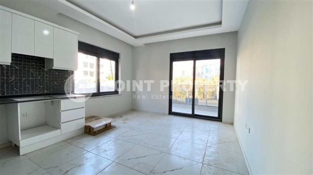 Апартаменты 1+1 в чистовой отделке в центре района Махмутлар.-id-3962-фото-4