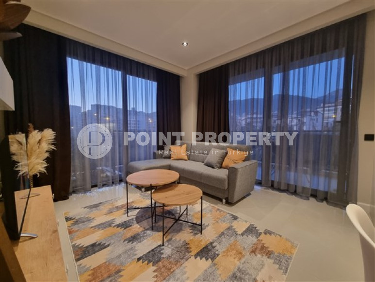 Beautiful studio apartment with modern design in the popular Oba area of Alanya.-id-3988-photo-3