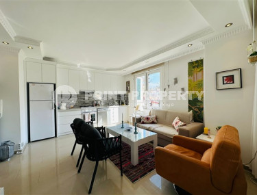 Светлая меблированная квартира 2+1 в 150 метрах от пляжа в центре популярного района Аланьи Оба.-id-4001-фото-4