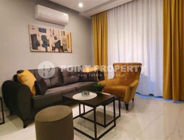 A small modern apartment with excellent renovation and stylish design in the very center of Alanya. Description:-id-4004-photo-1