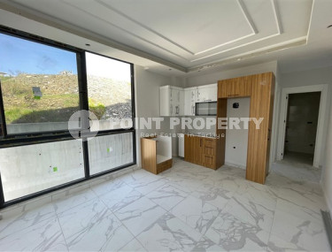 Apartment 1+1 with fine finishing in a house at the final stage of construction. The date for putting the facility into operation is May 2023.-id-4046-photo-1