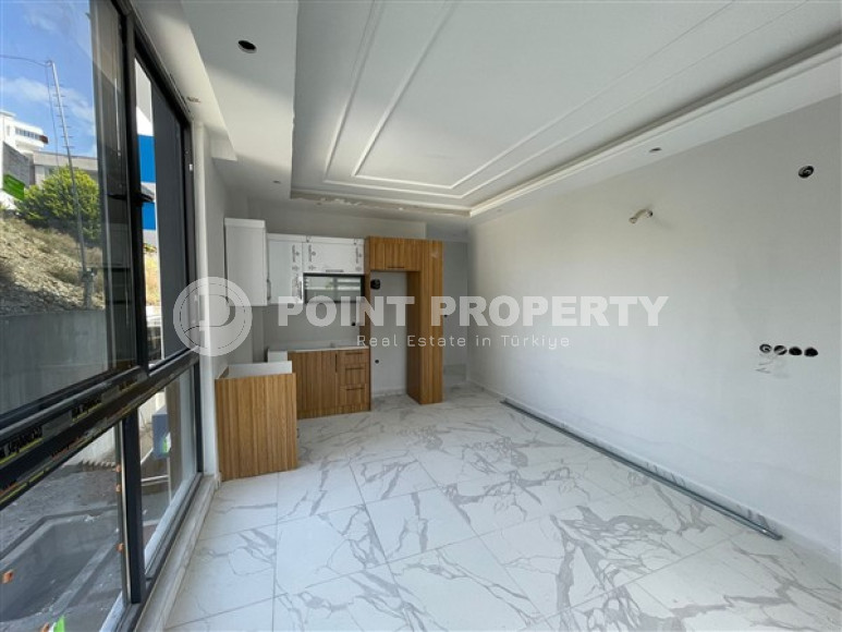 Apartment 1+1 with fine finishing in a house at the final stage of construction. The date for putting the facility into operation is May 2023.-id-4046-photo-2