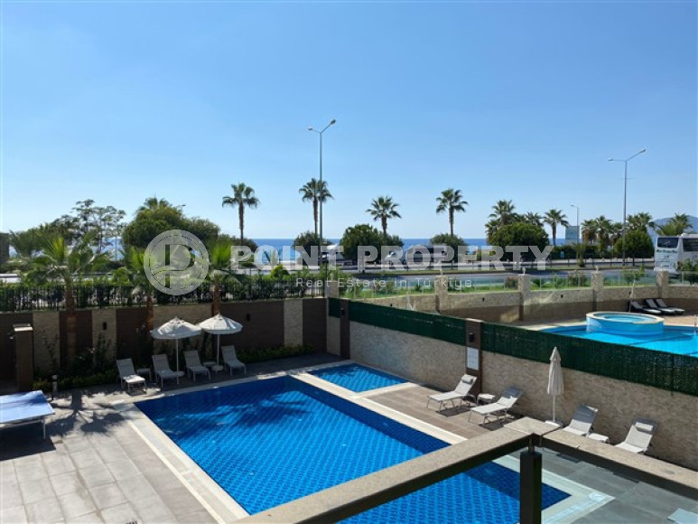 New furnished 1+1 apartment on the first line from the sea in the center of Kestel.-id-4071-photo-12
