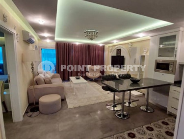 Современная квартира 1+1, общей площадью 70 м2, в 150 метрах от моря в центре района Кестель.-id-4081-фото-3