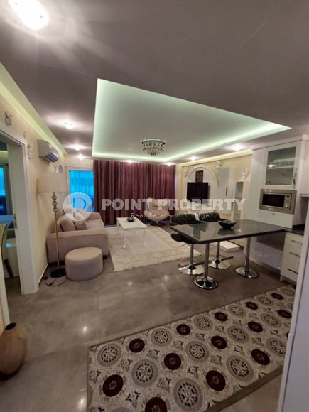 Современная квартира 1+1, общей площадью 70 м2, в 150 метрах от моря в центре района Кестель.-id-4081-фото-3