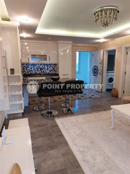 Современная квартира 1+1, общей площадью 70 м2, в 150 метрах от моря в центре района Кестель.-id-4081-фото-1