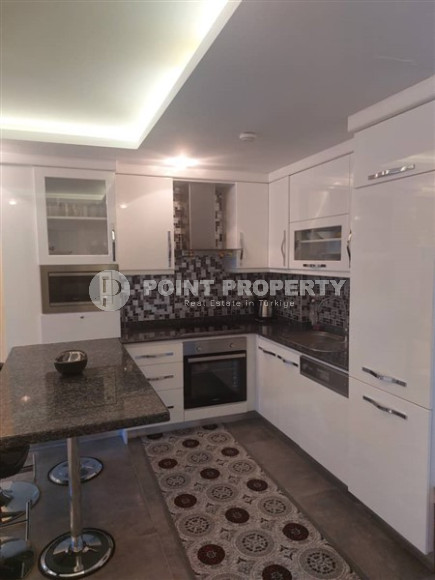 Современная квартира 1+1, общей площадью 70 м2, в 150 метрах от моря в центре района Кестель.-id-4081-фото-2