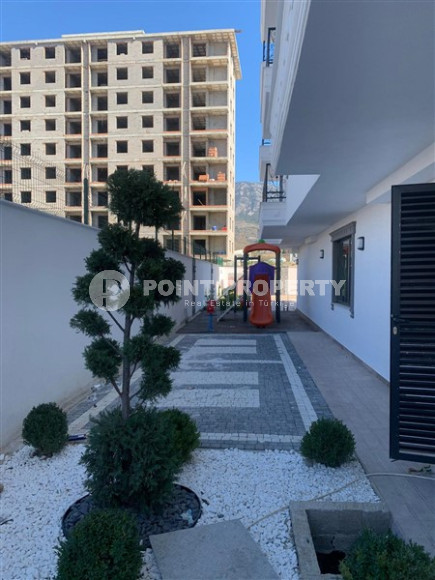 New 2+1 apartment with an area of 125 m2 at the stage of completion of finishing works, Mahmutlar district-id-4087-photo-2