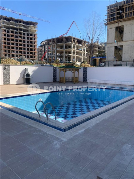 New 2+1 apartment with an area of 125 m2 at the stage of completion of finishing works, Mahmutlar district-id-4087-photo-4