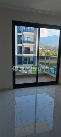 Уютная двухкомнатная квартира 50 м2 в новой резиденции на удалении от моря, район Оба-id-4106-фото-12