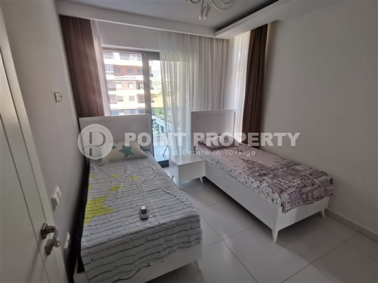 Просторная двухкомнатная квартира с современным дизайном в 700 метрах от моря в прекрасном спокойном районе Каргыджак.-id-4118-фото-6