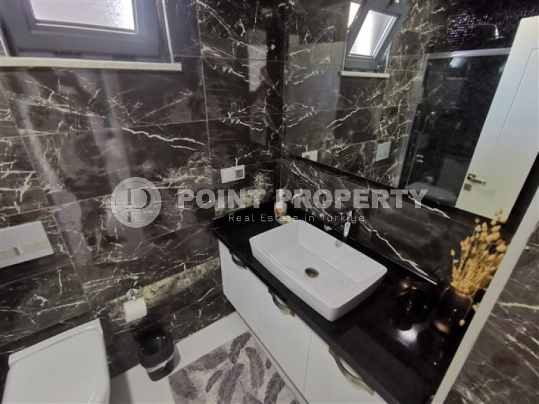 Просторная двухкомнатная квартира с современным дизайном в 700 метрах от моря в прекрасном спокойном районе Каргыджак.-id-4118-фото-7