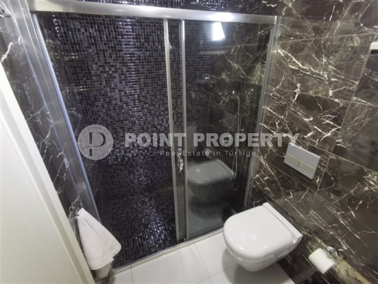 Просторная двухкомнатная квартира с современным дизайном в 700 метрах от моря в прекрасном спокойном районе Каргыджак.-id-4118-фото-8