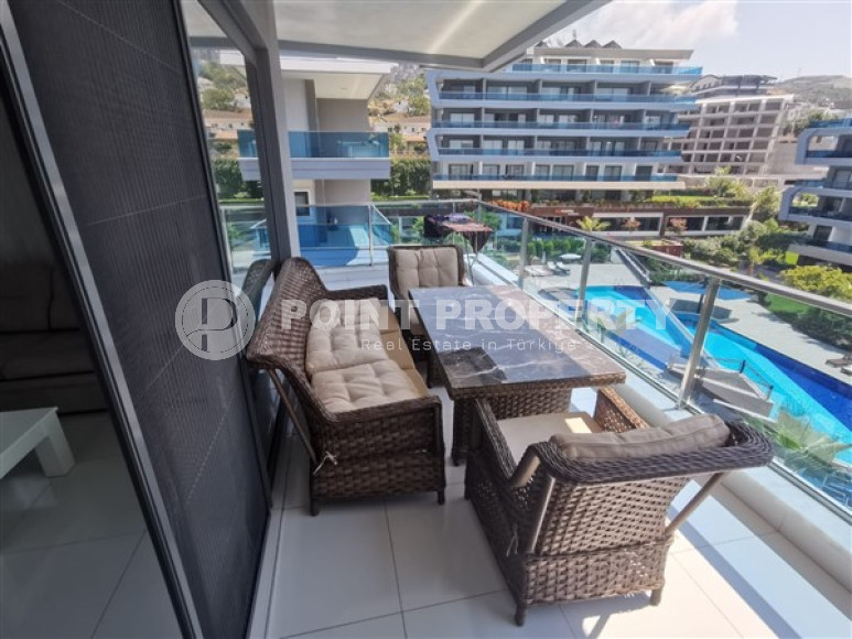 Просторная двухкомнатная квартира с современным дизайном в 700 метрах от моря в прекрасном спокойном районе Каргыджак.-id-4118-фото-9