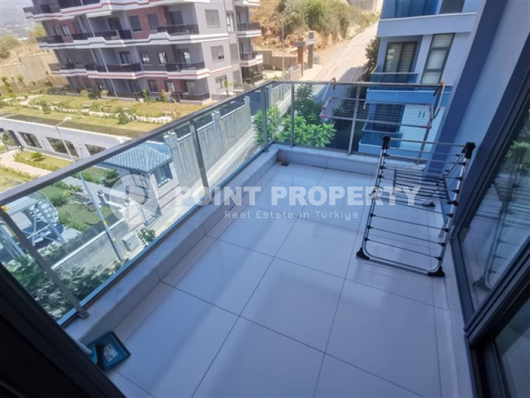 Просторная двухкомнатная квартира с современным дизайном в 700 метрах от моря в прекрасном спокойном районе Каргыджак.-id-4118-фото-11