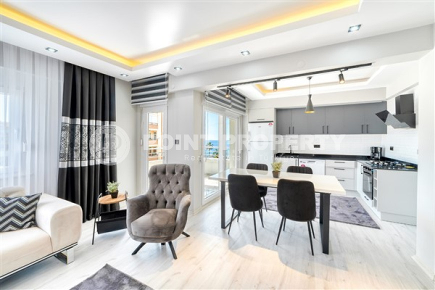 Стильная квартира 3+1 с дизайнерским ремонтом в 50 метрах от пляжа и набережной в популярном районе Махмутлар.-id-4126-фото-2