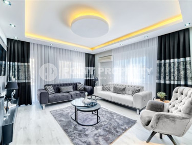 Stylish 3+1 apartment with designer renovation 50 meters from the beach and promenade in the popular Mahmutlar area.-id-4126-photo-3