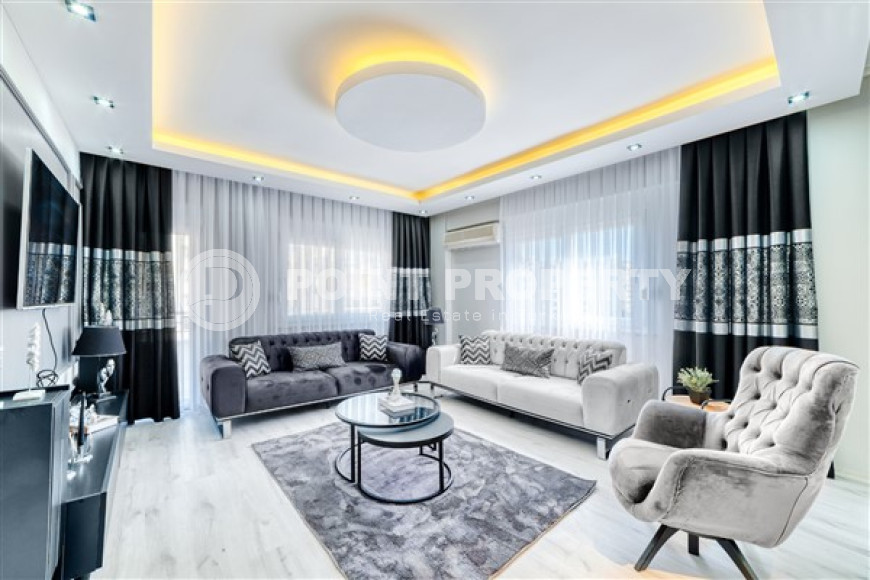 Стильная квартира 3+1 с дизайнерским ремонтом в 50 метрах от пляжа и набережной в популярном районе Махмутлар.-id-4126-фото-3