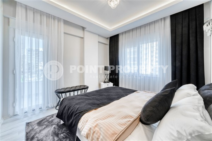 Стильная квартира 3+1 с дизайнерским ремонтом в 50 метрах от пляжа и набережной в популярном районе Махмутлар.-id-4126-фото-7