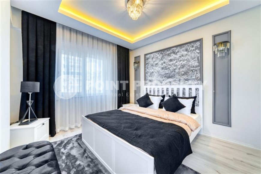 Стильная квартира 3+1 с дизайнерским ремонтом в 50 метрах от пляжа и набережной в популярном районе Махмутлар.-id-4126-фото-8