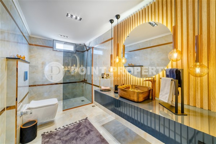 Стильная квартира 3+1 с дизайнерским ремонтом в 50 метрах от пляжа и набережной в популярном районе Махмутлар.-id-4126-фото-10