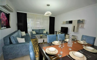 Spacious furnished two-bedroom apartment in the center of Mahmutlar.-id-4133-photo-1