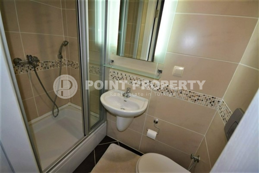 Spacious furnished two-bedroom apartment in the center of Mahmutlar.-id-4133-photo-7