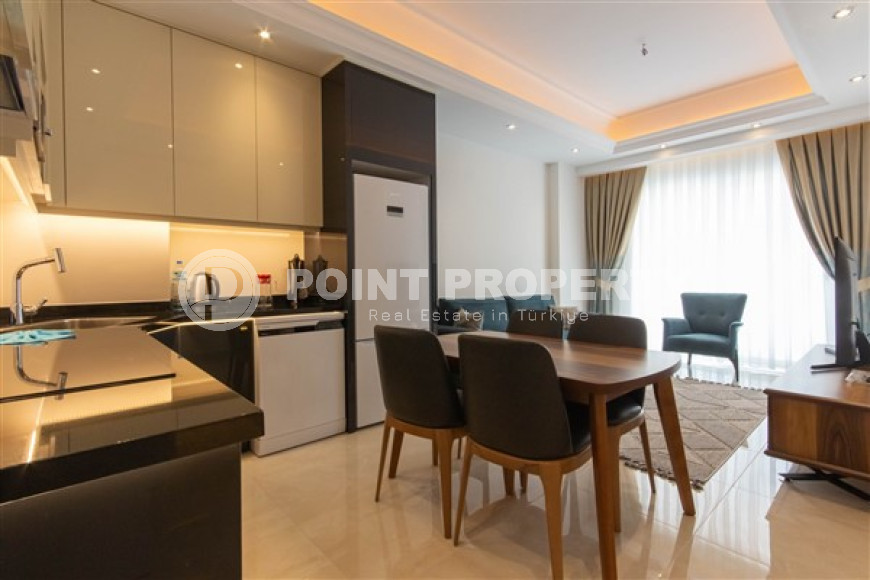 Меблированные двухкомнатные апартаменты 1+1 с площадью 65 м2, Махмутлар-id-4141-фото-15