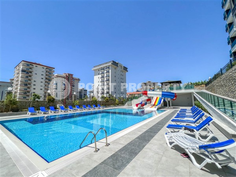 Three-room apartment on the 3rd floor in a new high-rise complex, Mahmutlar district.-id-4153-photo-2