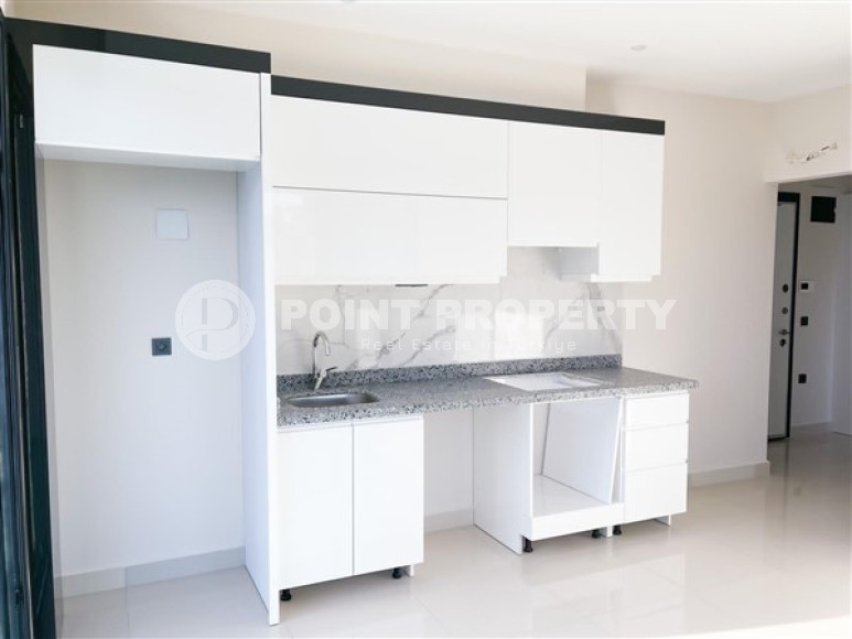 Three-room apartment on the 3rd floor in a new high-rise complex, Mahmutlar district.-id-4153-photo-5