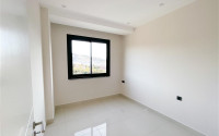 Three-room apartment on the 3rd floor in a new high-rise complex, Mahmutlar district.-id-4153-photo-8