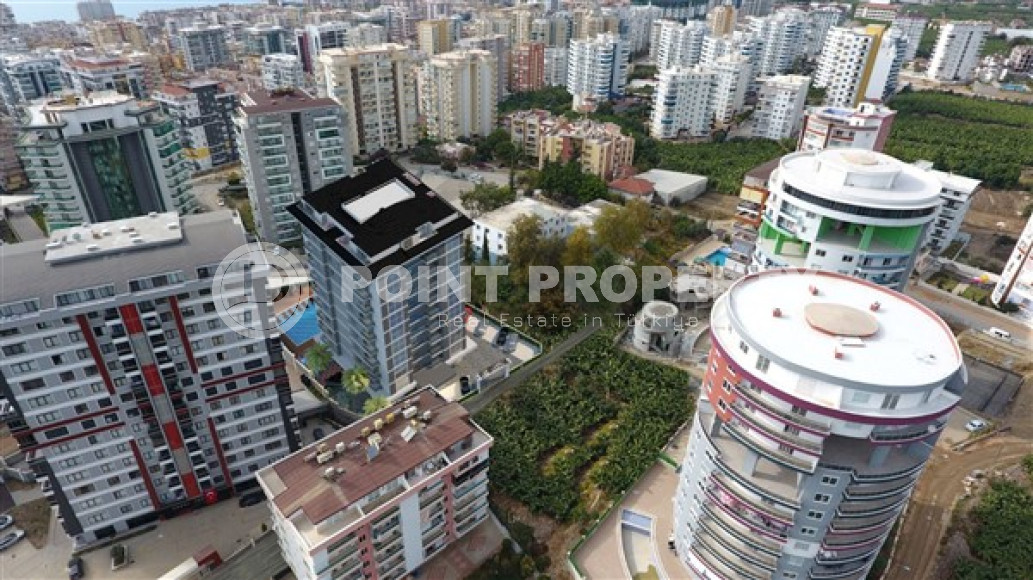 Apartments in a house under construction 800 meters from the sea in the center of Mahmutlar.-id-4161-photo-4