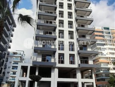 1+1 apartments with fine finishing in a house at the final stage of construction in the center of the popular Mahmutlar area.-id-4162-photo-1